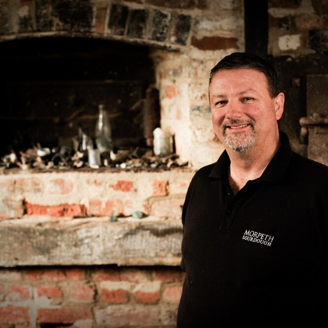 Stephen Arnott standing in front of the old oven in Morpeth